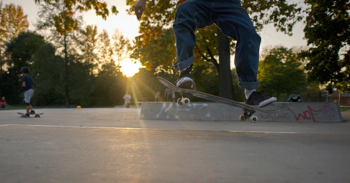 What is the trick to create 4 layer Chapati? - Person in Blue Denim Jeans and Black Shoes Riding Skateboard