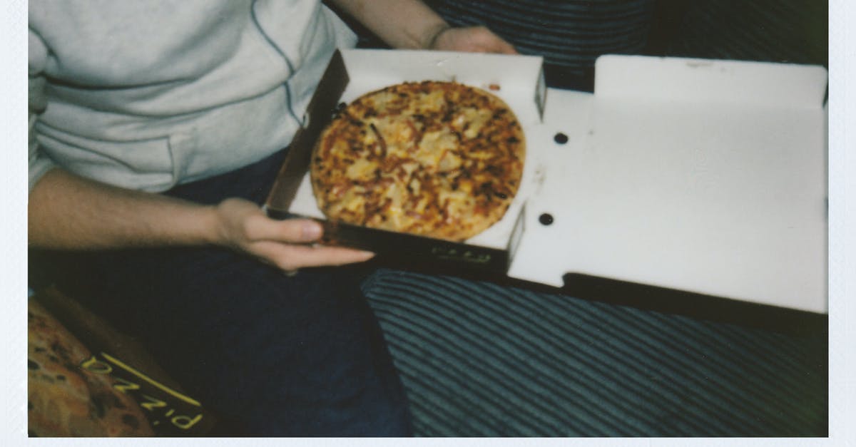 What is the type of cheese in "chips and cheese" UK fast-food? (with photos) - Person Sitting Holding a Box of Pizza What is the type of cheese in "chips and cheese" UK fast-food? (with photos) - Person Sitting Holding a Box of Pizza