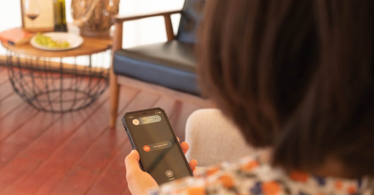 What is this device? - Woman Holding Black Iphone 5