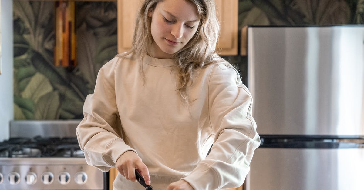 What is this slicing (?) tool? - Woman in White Long Sleeve Shirt Holding Smartphone