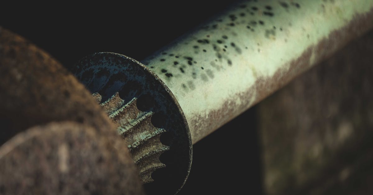 What is used in the production of dubu (Korean tofu)? - Closeup of old weathered rusty pipe of metal mechanism in industrial workshop against blurred background
