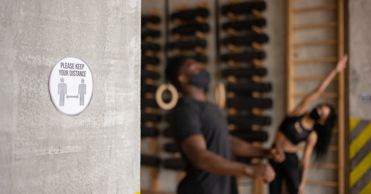 What is your training regimen for developing your palate? - Distance sign in gym with unrecognizable black sportspeople during workout