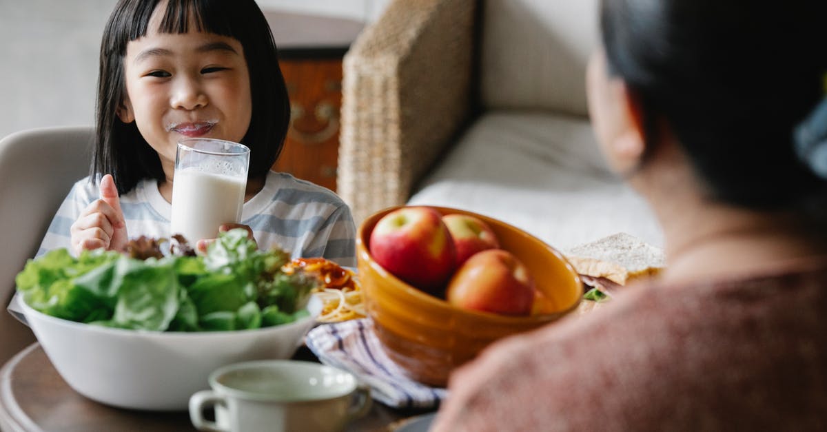 What kind of apple fermented drink did I just make? - Happy Asian little girl drinking milk while smiling