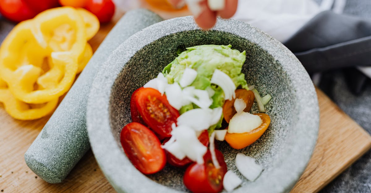 What kind of mortar and pestle is most food safe? - Sliced Cucumber and Red Tomato on Gray Ceramic Bowl
