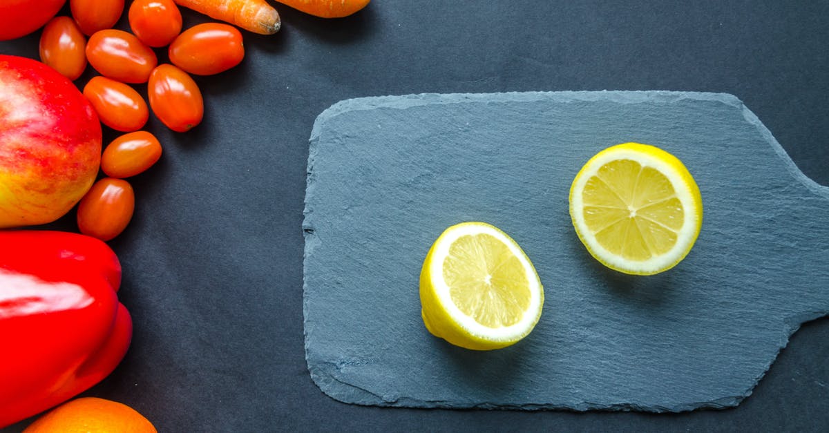what makes red tomato sauce turn orange in colour? - Sliced Lemon on Blue Chopping Board