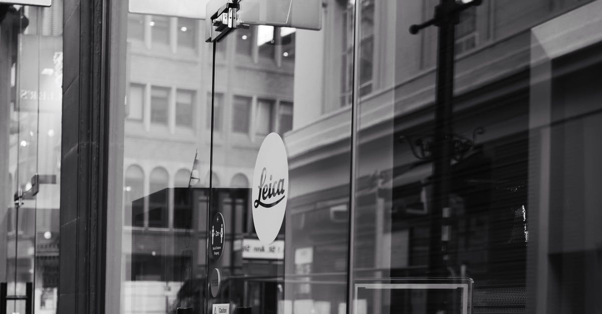 What makes store brand mayo white? - Grayscale Photo of a Storefront