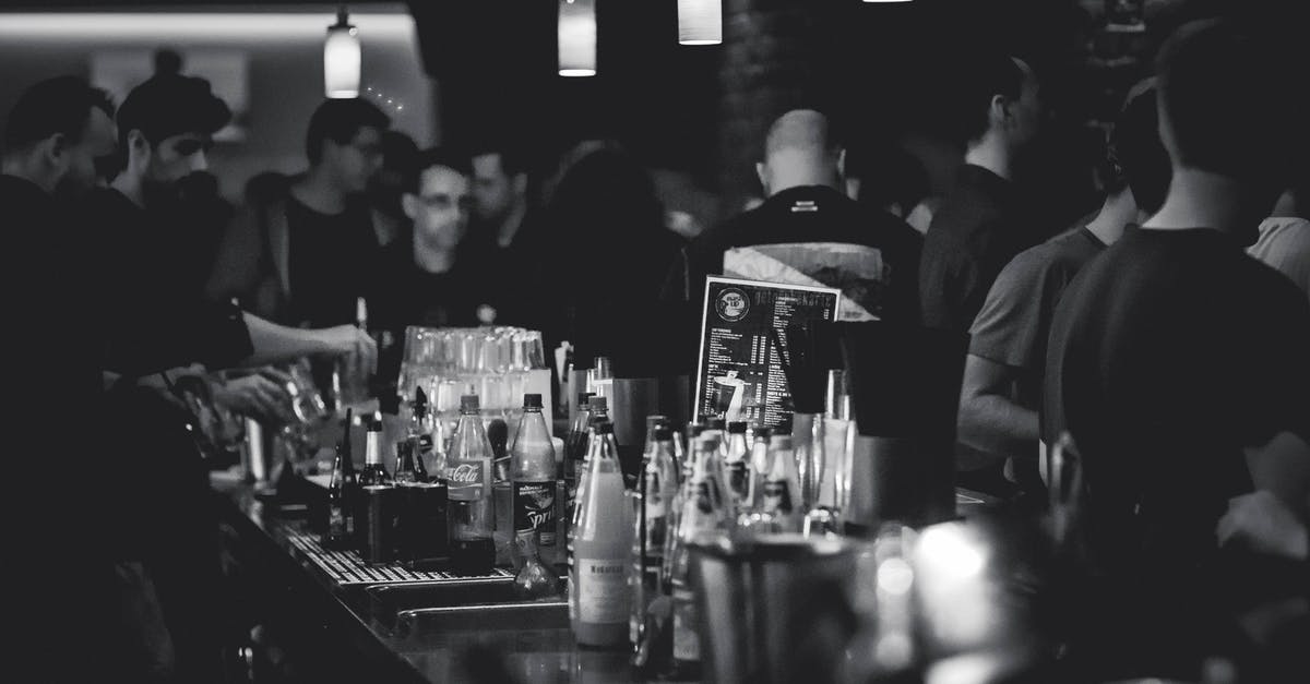 What mammals' milks are drunk by humans? - Grayscale Photography of Bottles on Top of Table