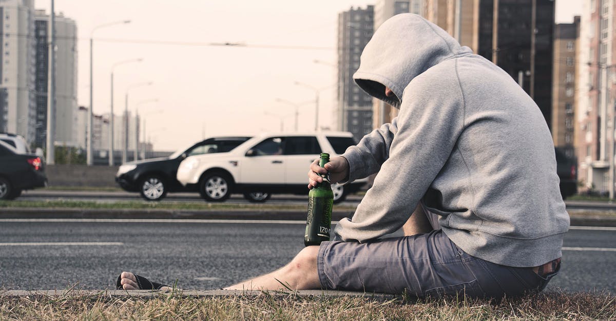 What mammals' milks are drunk by humans? - Person in Gray Hoodie Holding Beer