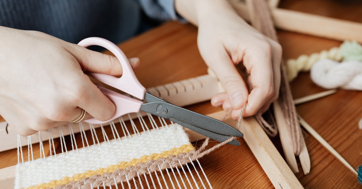 what material should i use for cutting board? - Person Cutting a Yarn