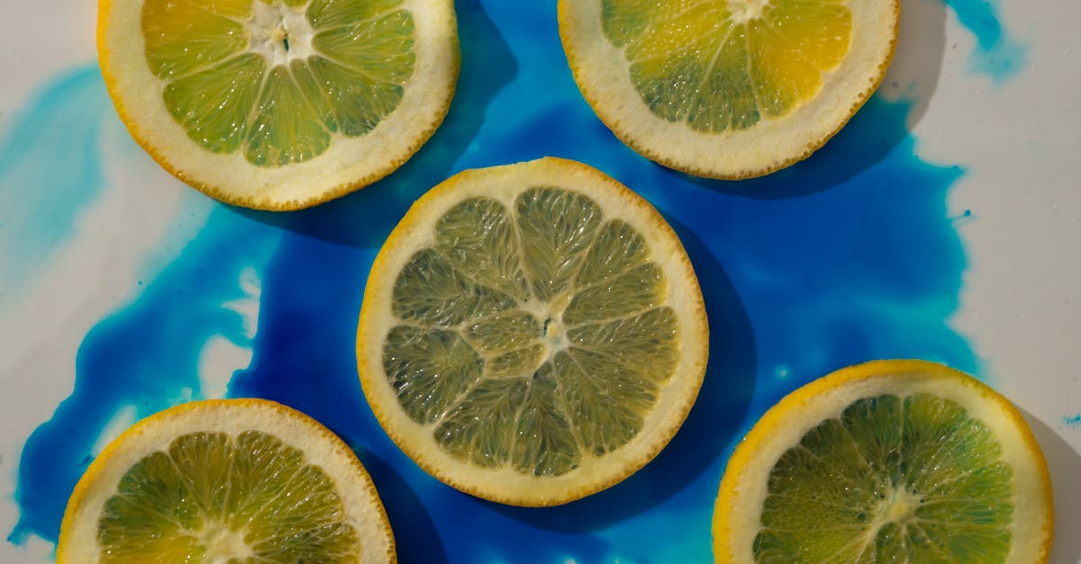 What natural ingredients can be used to color food blue or green? - Lemon slices on blue and white surface