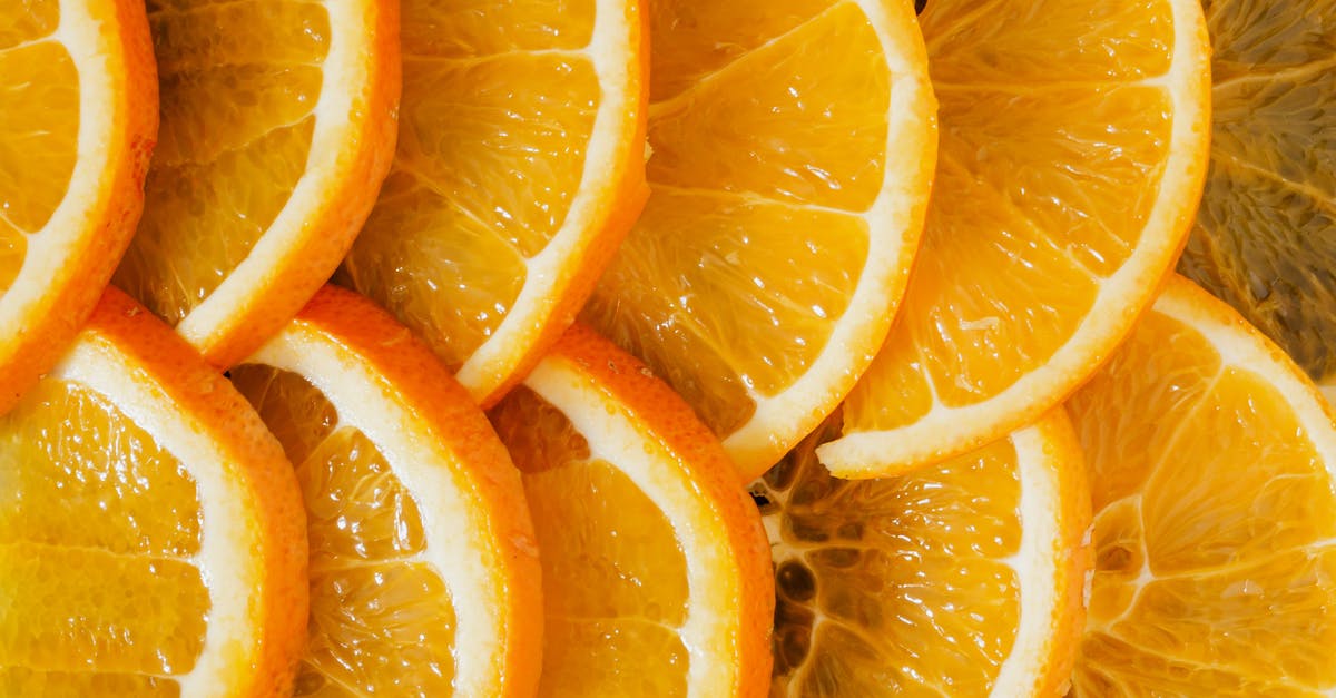 What nutrients are concentrated in citrus peels (not juice)? - Top view of delicious sliced oranges arranged near each other as minimalist background of organic nutrition