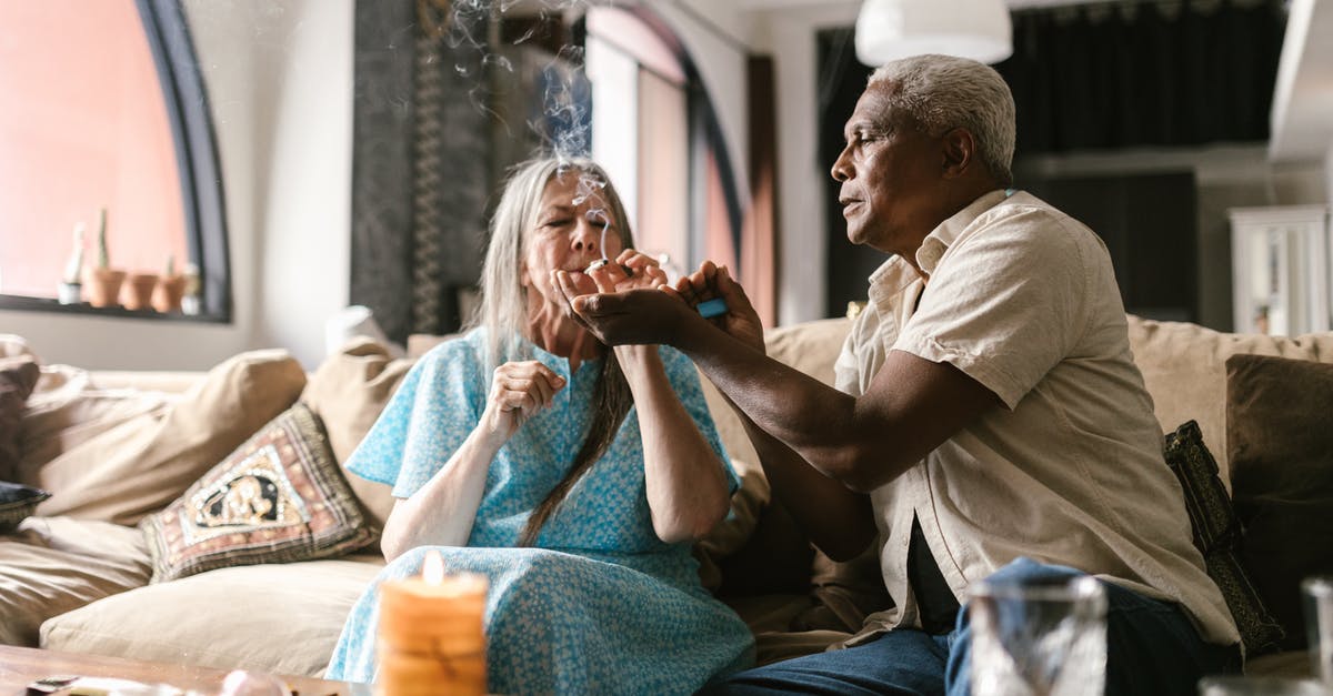 What oil has a smoking temperature high enough for broiling? - An Elderly Couple Smoking in the Living Room