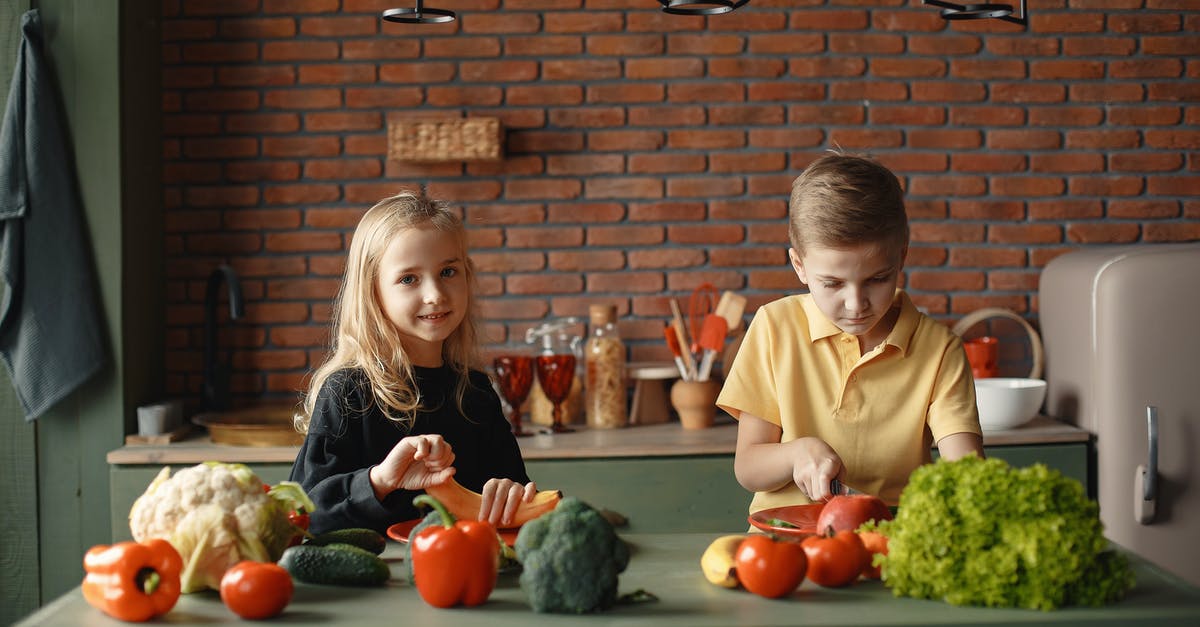 What preparation is done to banana peppers? - Children in the Kitchen Slicing Vegetables