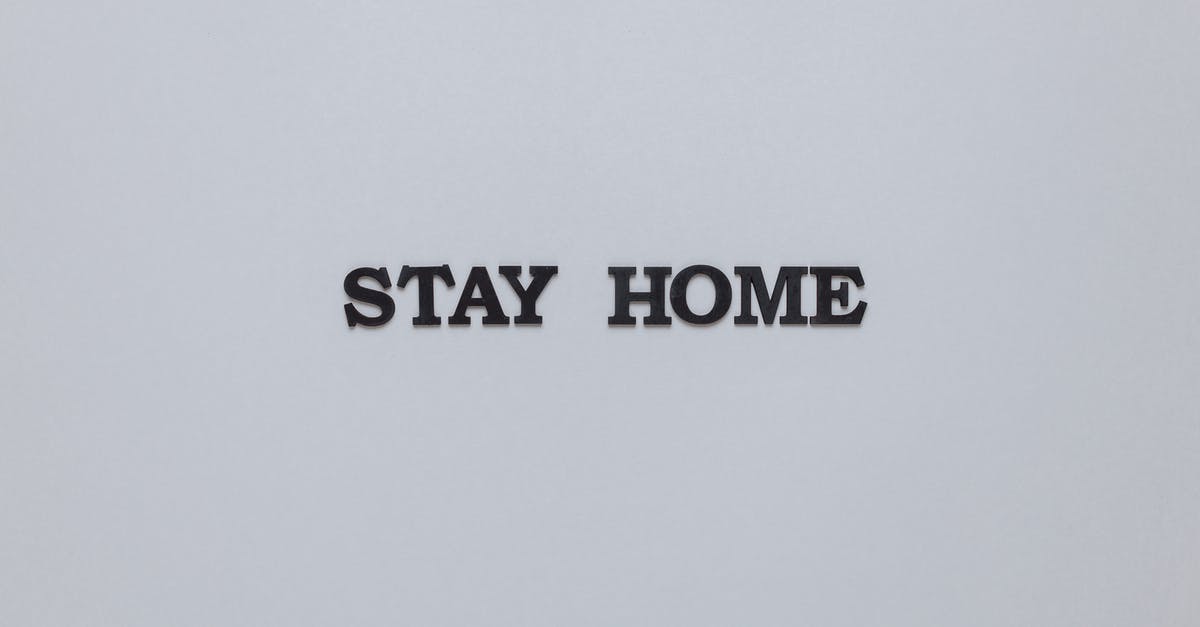 What safety precautions should be taken when attempting to flambe at home? - Stay Home Slogan On Gray Background