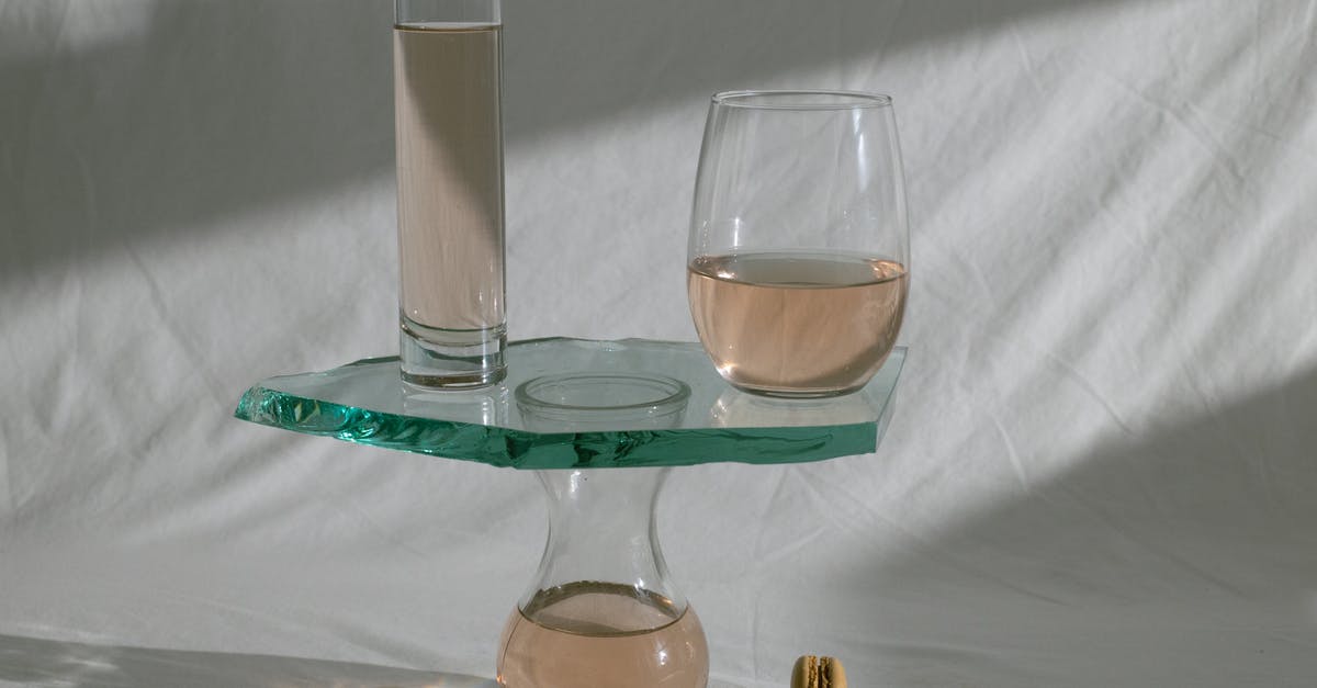 What shape is a French omelette and how is it achieved? - Composed glassware with wine and macaroons