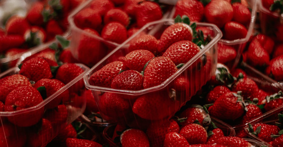 What should I look for in strawberries at the market? - Red Strawberries in Colorless Plastic Crate