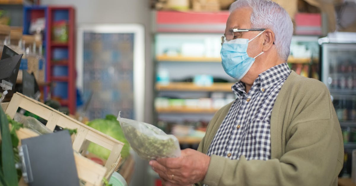 What should I look for when buying a ramen bowl? - Elderly Man looking at a Vegetable 