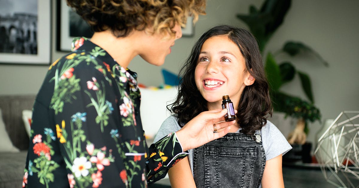 What should roasted pistachio oil smell like? - Woman In Black Floral Long Sleeve Shirt Holding A Bottle Of Essential Oil