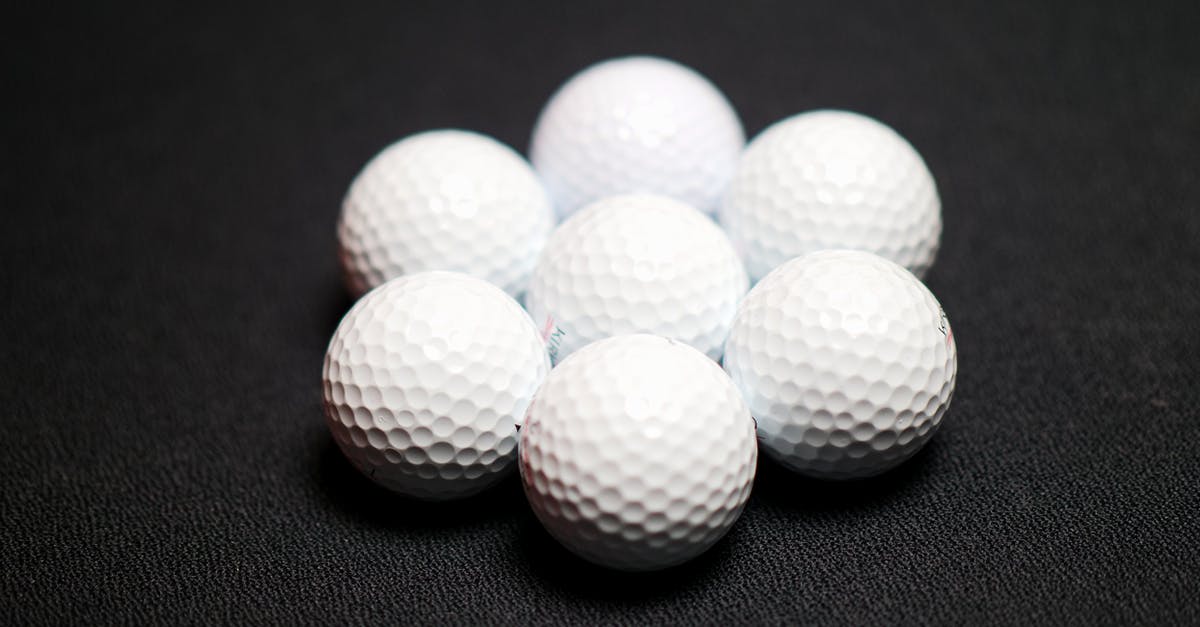 What size disher makes "1 inch balls of dough?" - Set of golf balls on black background