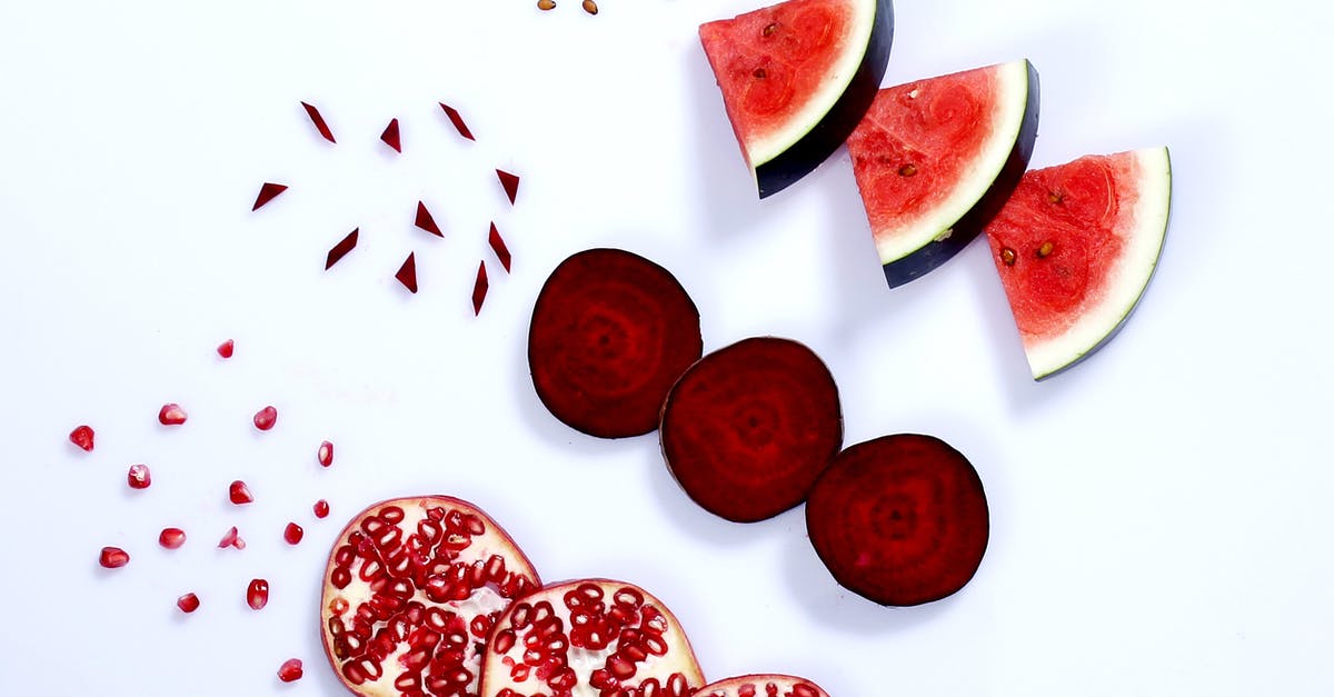 What species of red round watermelon is this? - Slices of Red Fresh Fruits on a White Surface