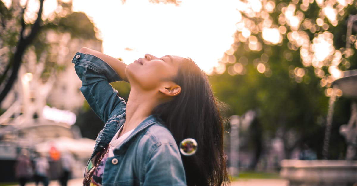 What style of icing is this please? - Carefree young woman enjoying life in city park