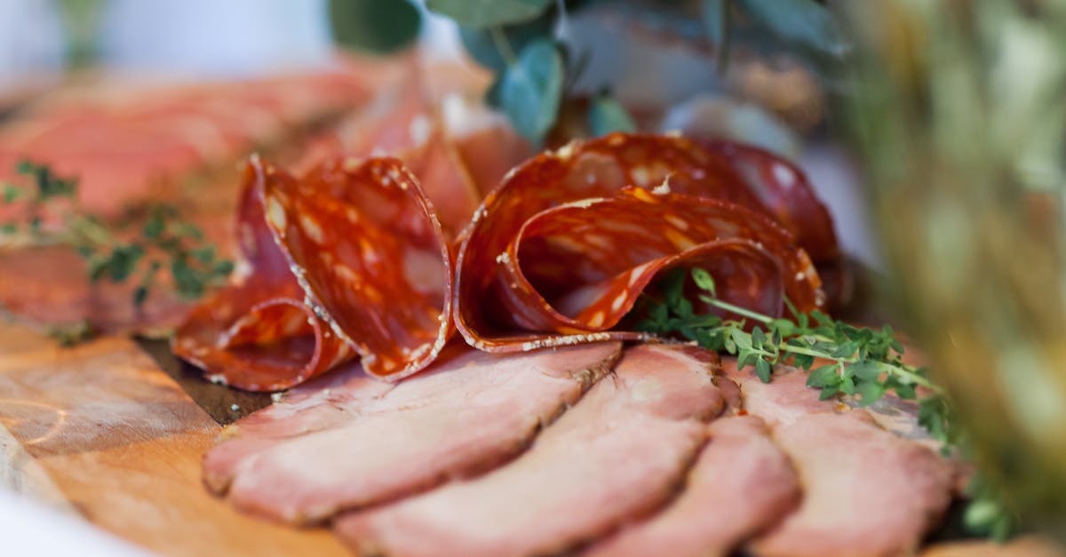 What temperature should I serve salami at? - Slices of delicious meat on wooden board