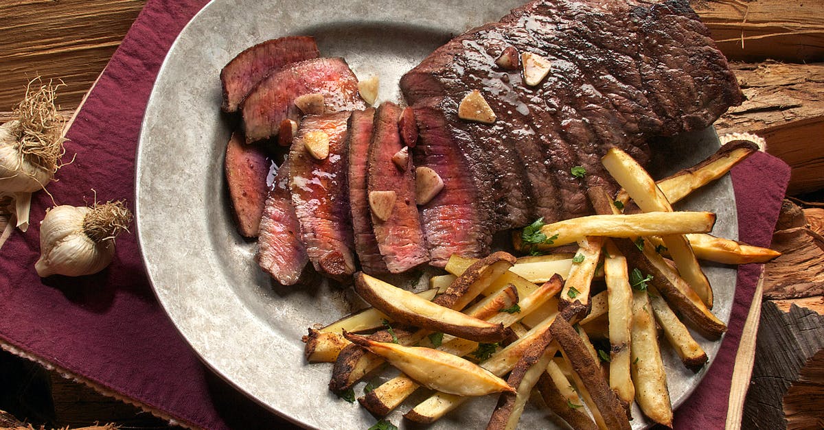 What to do with browned butter after frying a steak - Photo of Steak and French Fries on Gray Plate