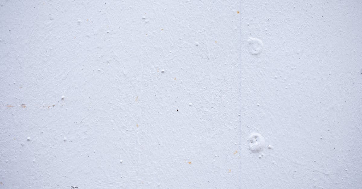 What to do with mochi...this version is white, hard and puck-like in shape? - Textured backdrop of wall with spots and dots on shabby light blue surface
