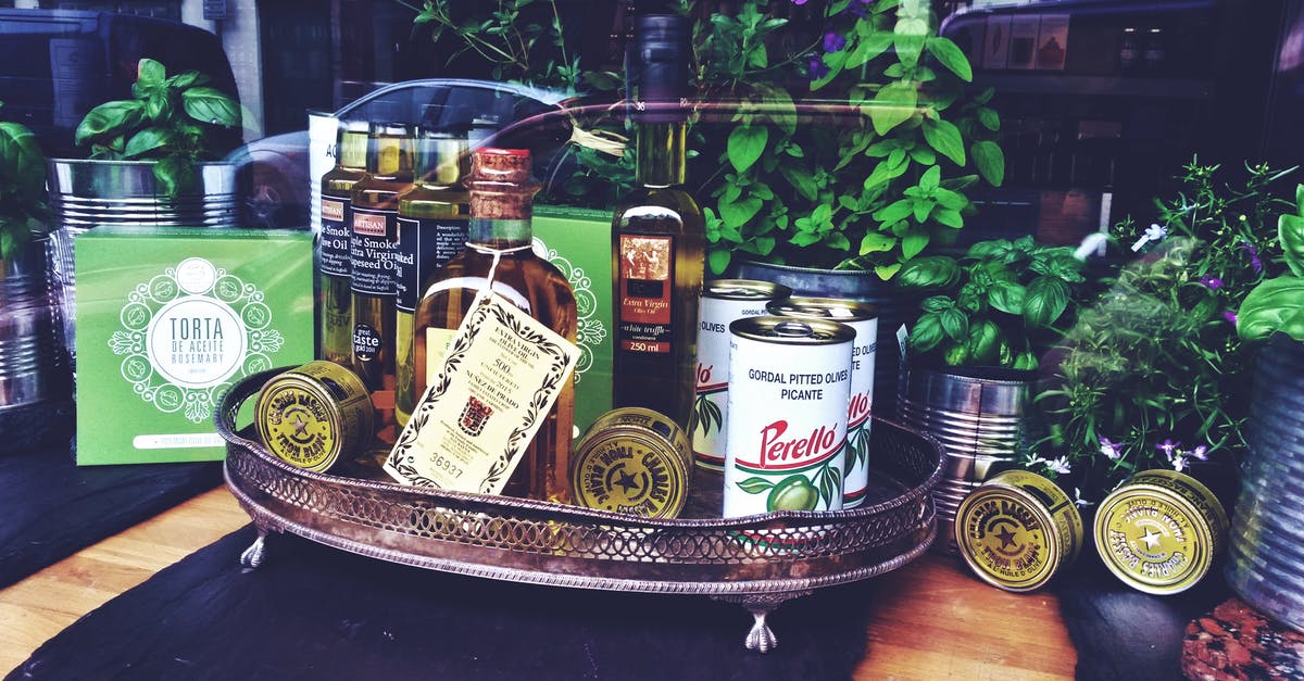 What to do with the olive oil from canned sardines? - Photo of Bottles and Can on Tray Near Plants