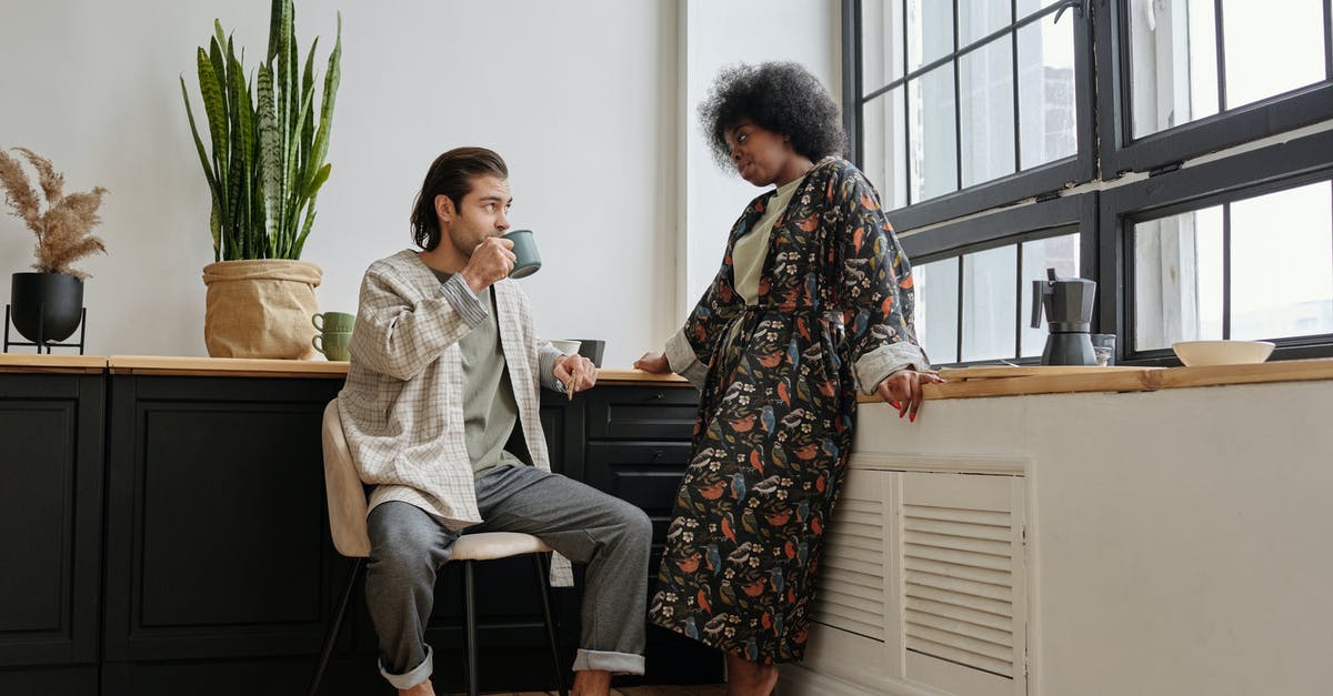 What to look for in a pot? - Woman Looking at a Man Sitting and Having Coffee