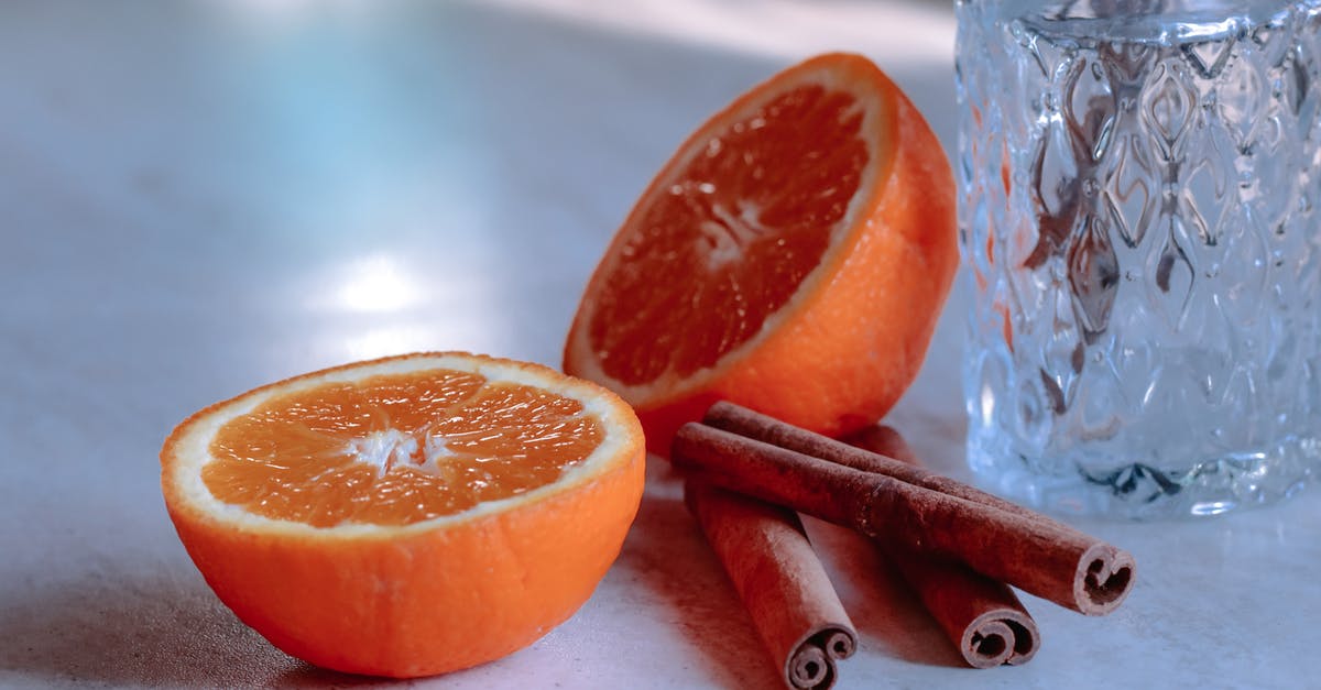 What to use to cut things on non stick surfaces? - Cut ripe orange and cinnamon sticks against vase