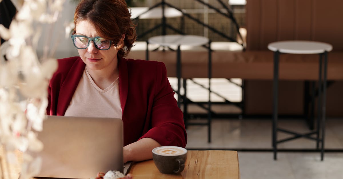 What types of meat should I pound and why? - Woman in Red Blazer Using Laptop