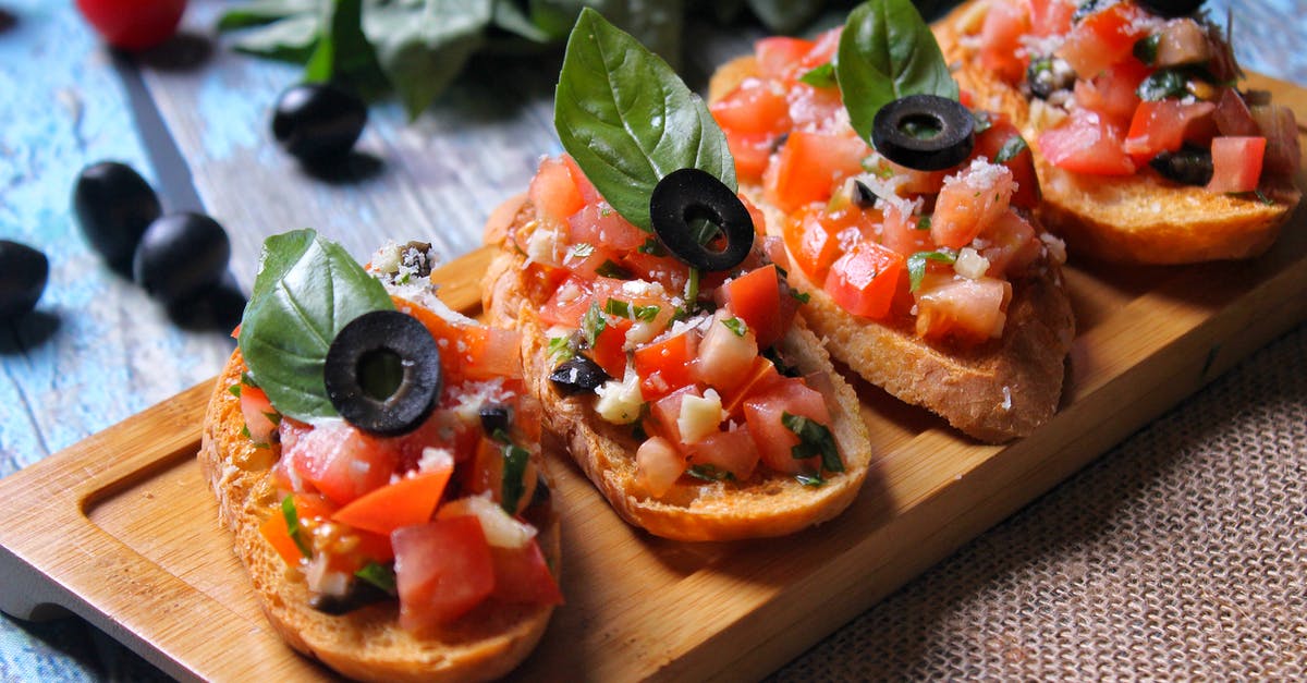 What uses are there for basil flowers? - Sliced Tomato and Green Vegetable on Brown Wooden Chopping Board