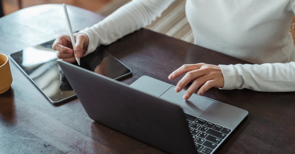 What was wrong with using White Truffle Oil? - Crop faceless female entrepreneur doing multitasking work on different devices