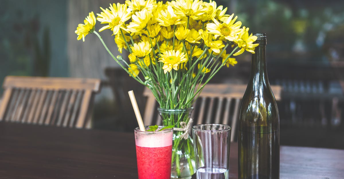 What wine(s) would you substitute for sweet red vermouth? - Yellow Daises in Clear Glass Vase Beside Bottle