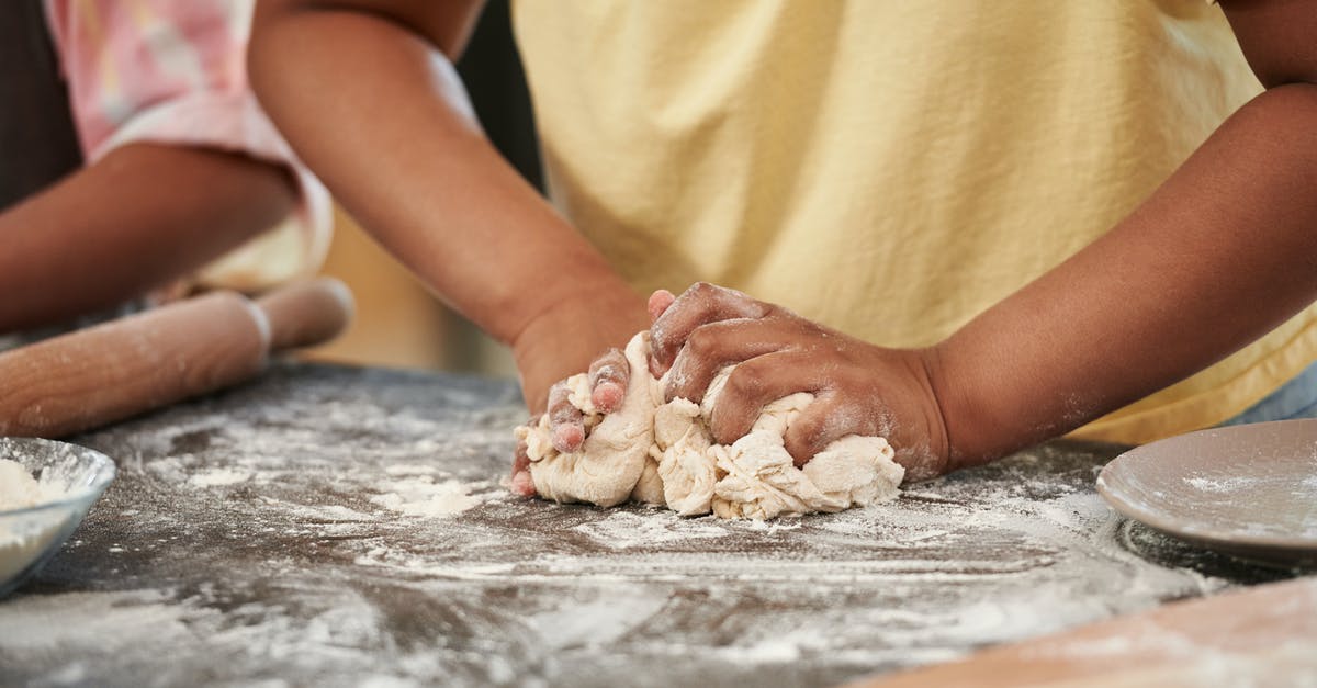 What would cause dough not to rise while making no-knead bread? - Man Kneading a Dough