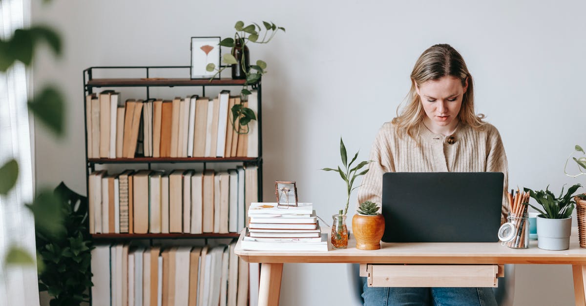 When are pot lids useful? - Concentrated freelancer working on laptop at home desk