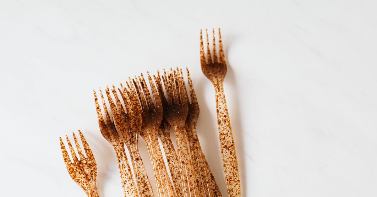 When basil gets brown spots, is it still usable? - Set of plastic fork on white table