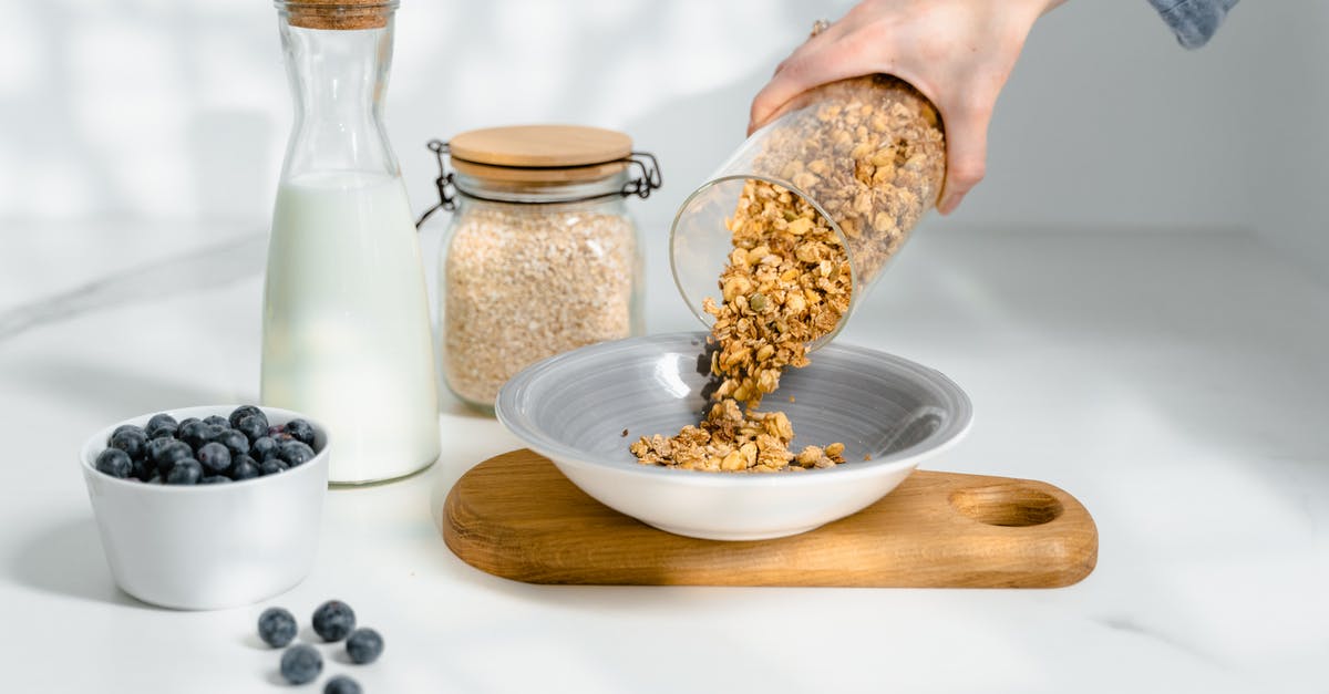 When milk is poured into cereal, what is it? [duplicate] - Person Pouring Cereals on Ceramic Bowl