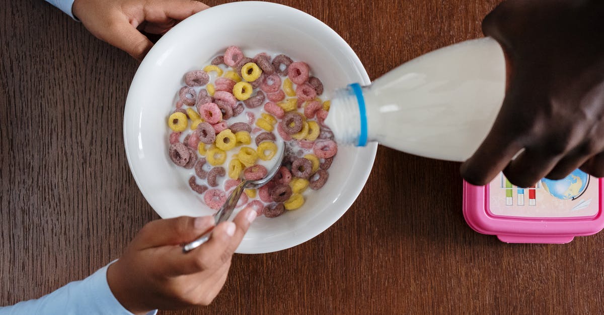 When milk is poured into cereal, what is it? [duplicate] - A Person Pouring Milk on Bowl of Cereals