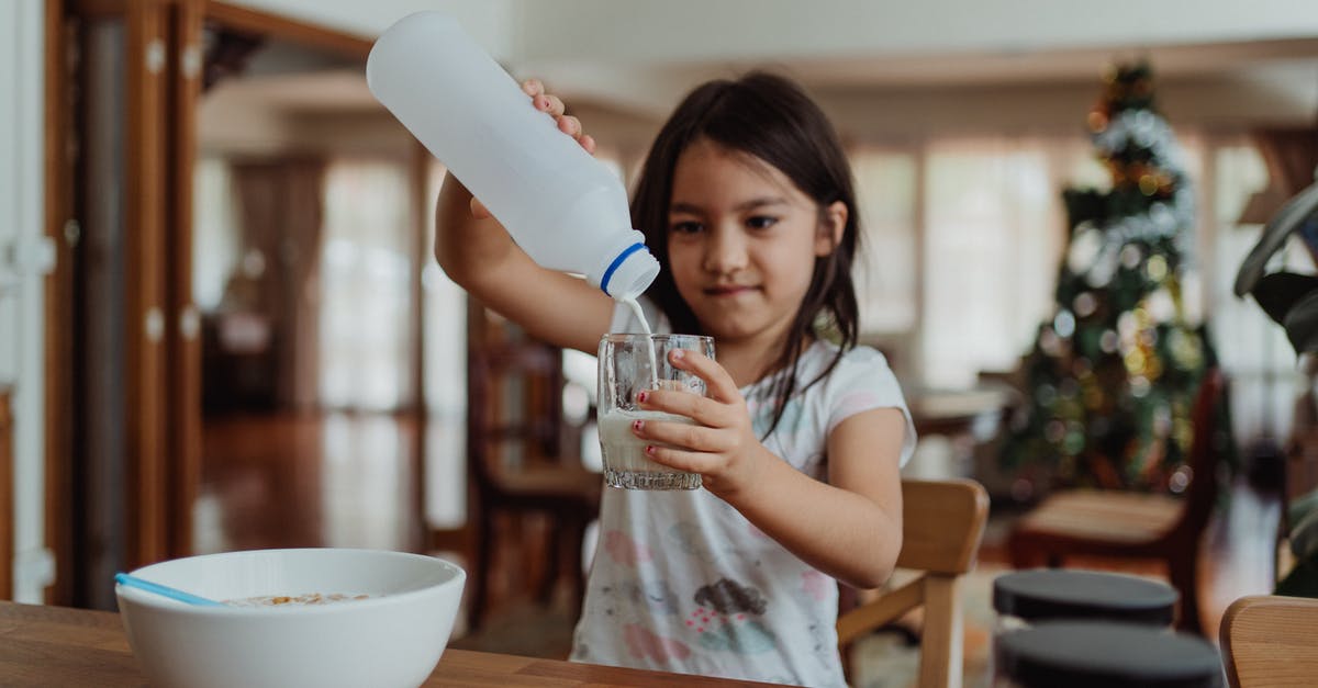 When milk is poured into cereal, what is it? [duplicate] - Woman in Blue Shirt Drinking from White Ceramic Mug