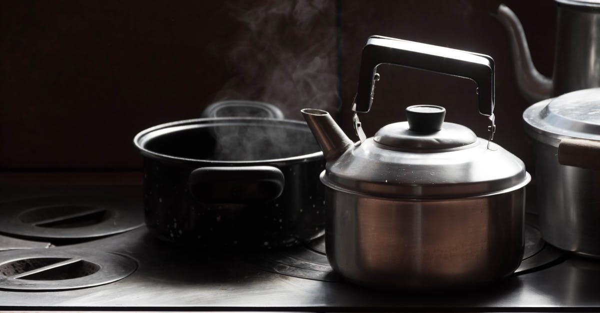 When skimming fats (while boiling meat), what percentage does it reduce? - Stainless Steel Kettle Beside Black Ceramic Mug