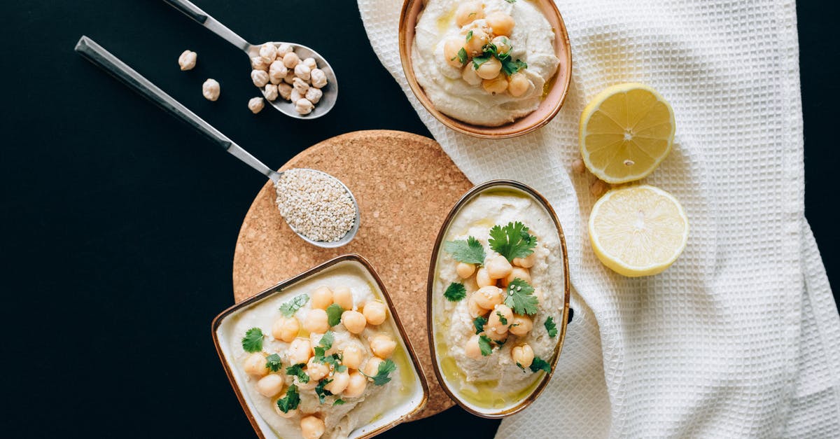 When soaking chickpeas (garbanzo beans), do I discard floaters? - Overhead Shot of Hummus Near a Sliced Lemon