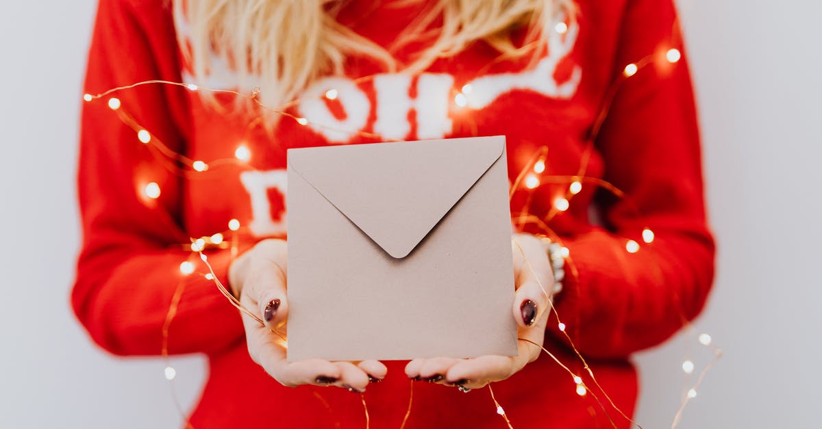 When to season popcorn? - Woman in Red Long Sleeve Shirt Holding White Box