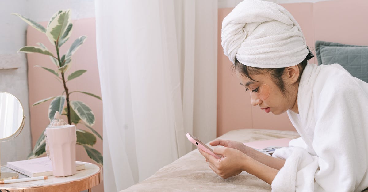 When using melted butter, is rendering (clarifying) always preferable? - Woman in White Hijab Holding Smartphone