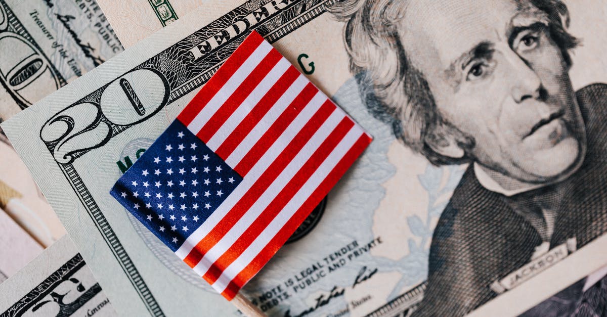 Where can I buy borosilicate (Pyrex) bakeware in the U.S.? - From above of small American flag placed on stack of 20 dollar bills as national currency for business financial operations