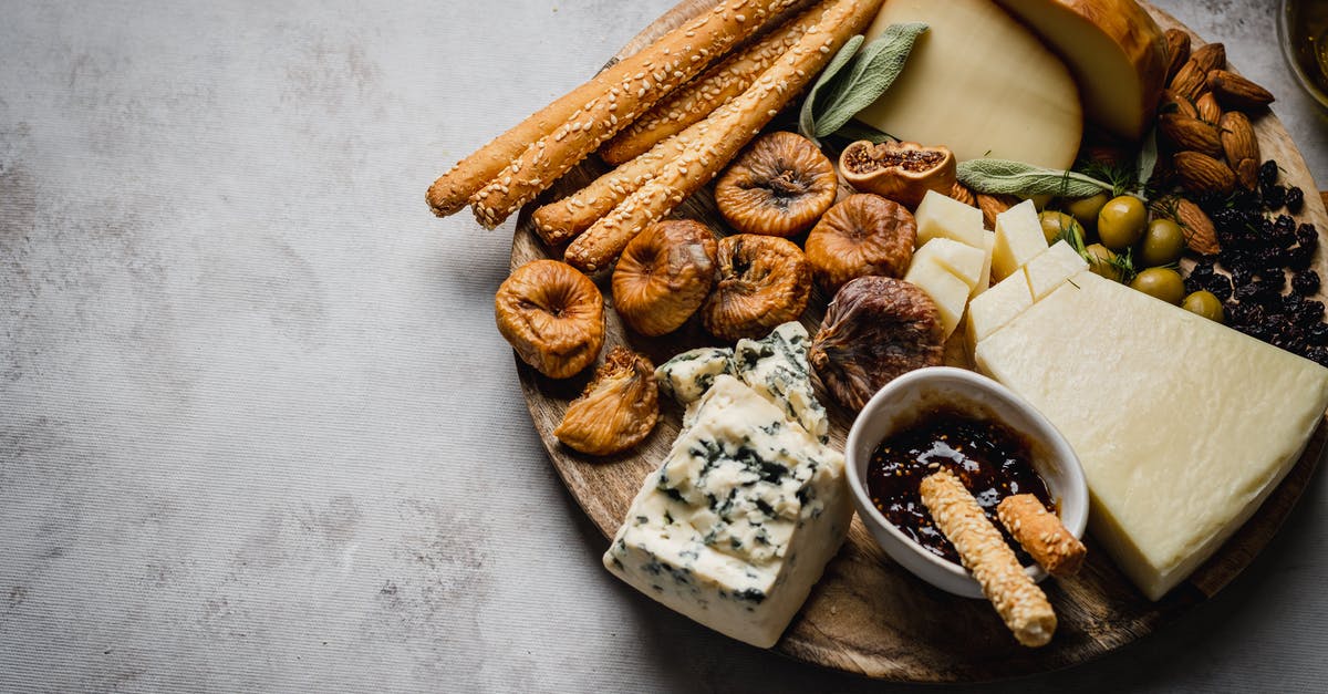 Where do I get weights for a Dutch-style cheese press? - Assorted Cheese and Nuts on the Wooden Platter