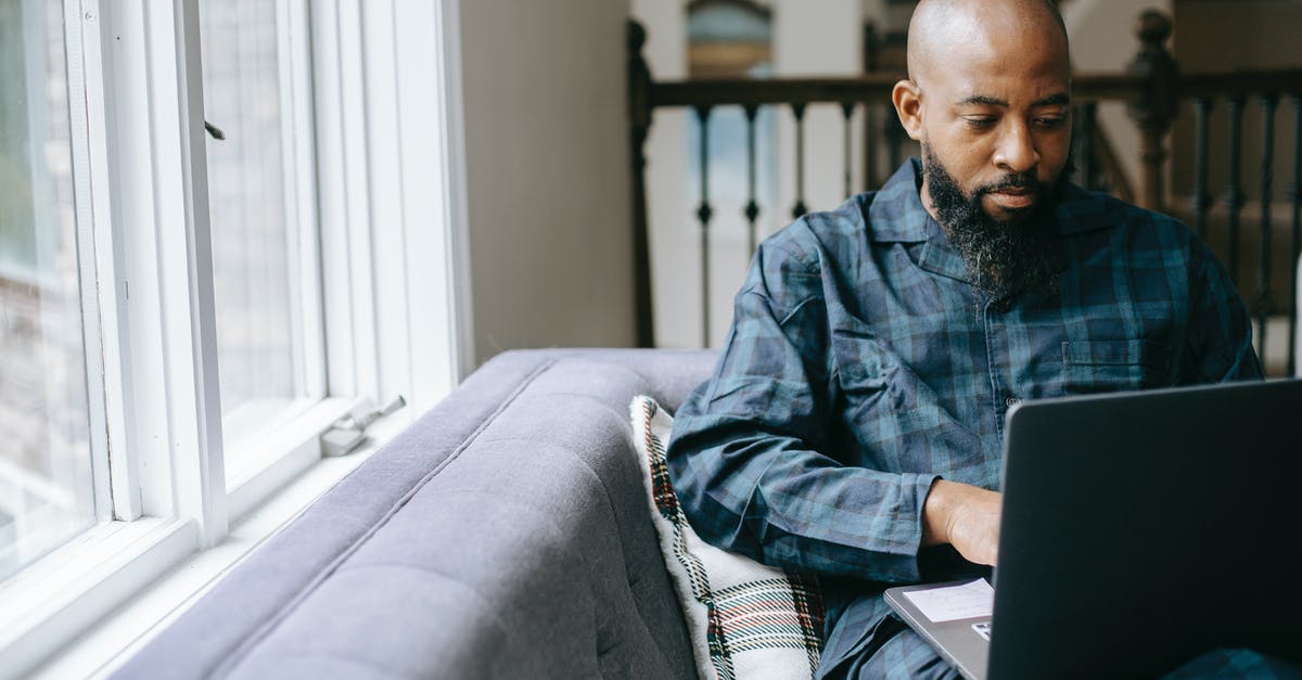 Where to learn what ratios to use in cooking? - Serious black man using laptop at home