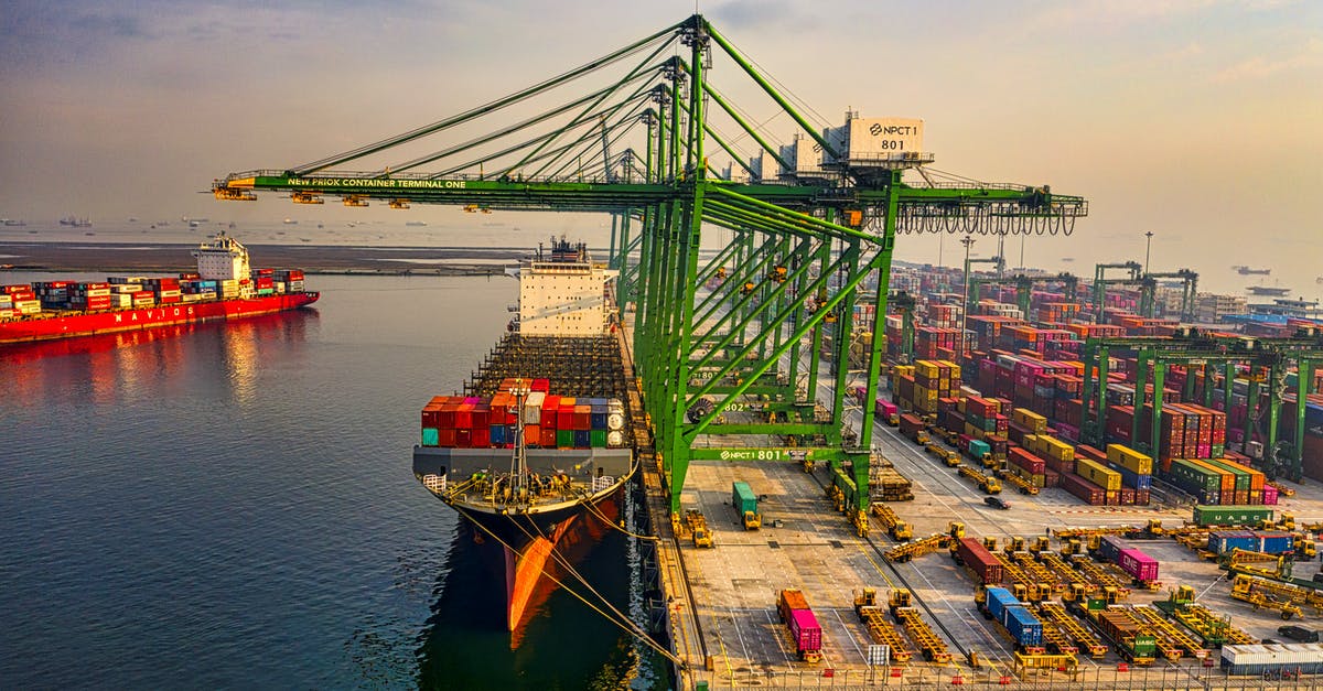 Which kinds of vessels insulate well? - Drone Shot of a Docked Cargo Ship at a Port