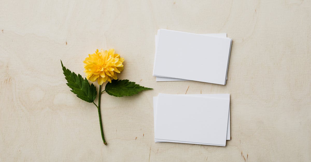 Which product for white chapatis? - Blank mockup business cards and yellow flower on desk